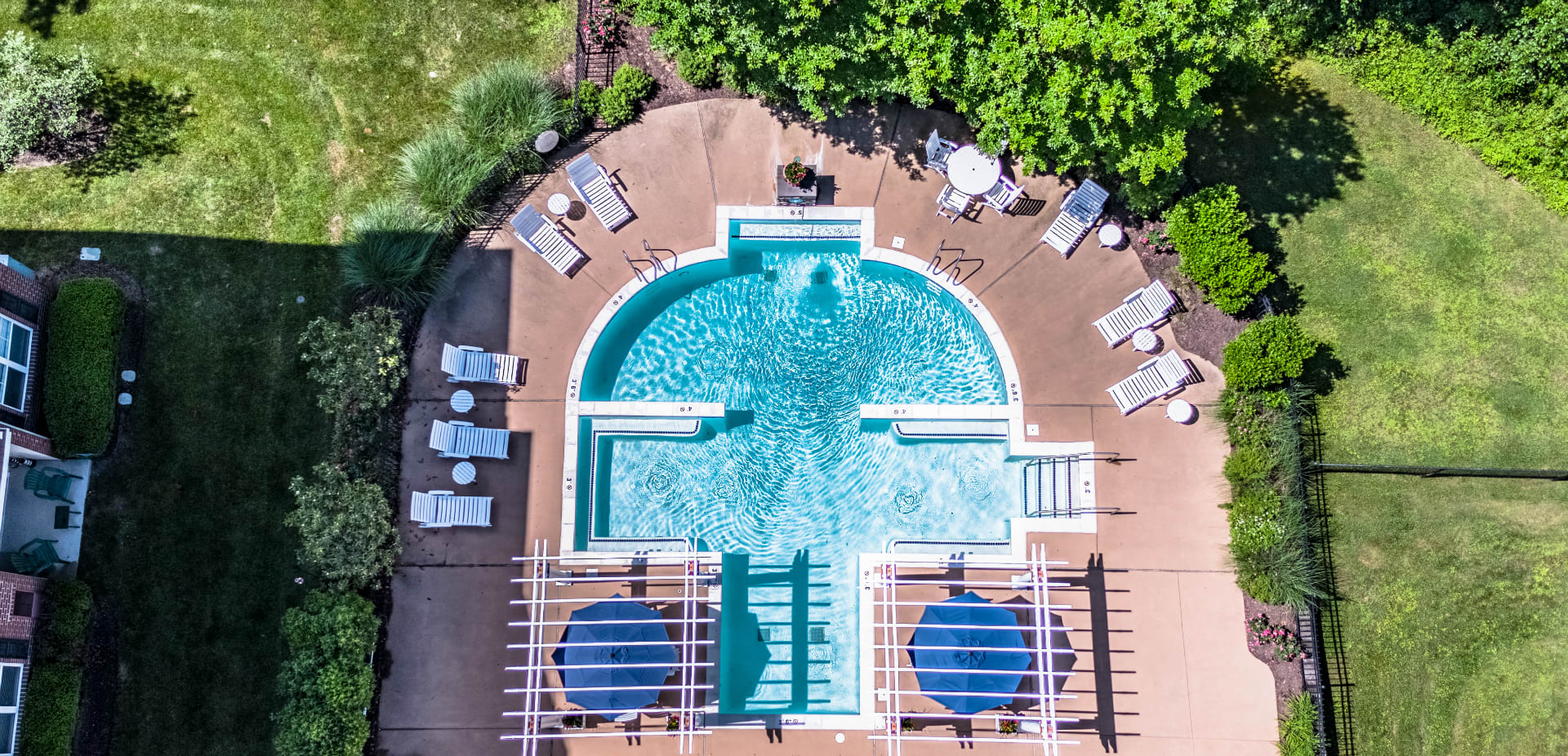 Seasonal pool and tanning deck within steps from your apartment backdoor. Enjoy luscious green space and the beauty of nature every day at Alexander Heights.